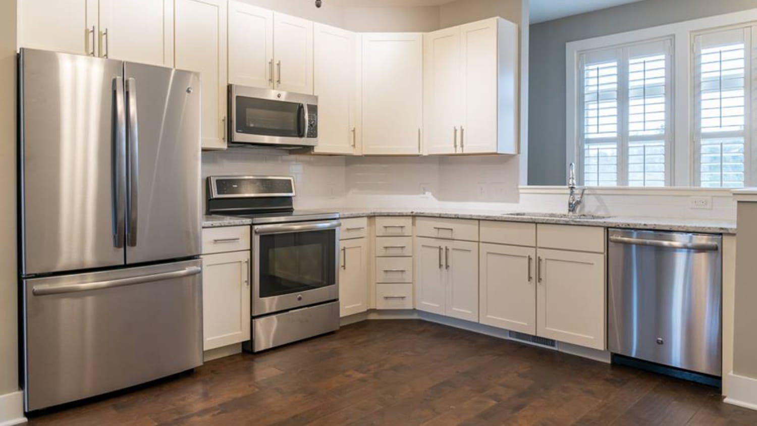 A kitchen with shiny new appliances at North Shore, a townhome complex on Centennial Campus.