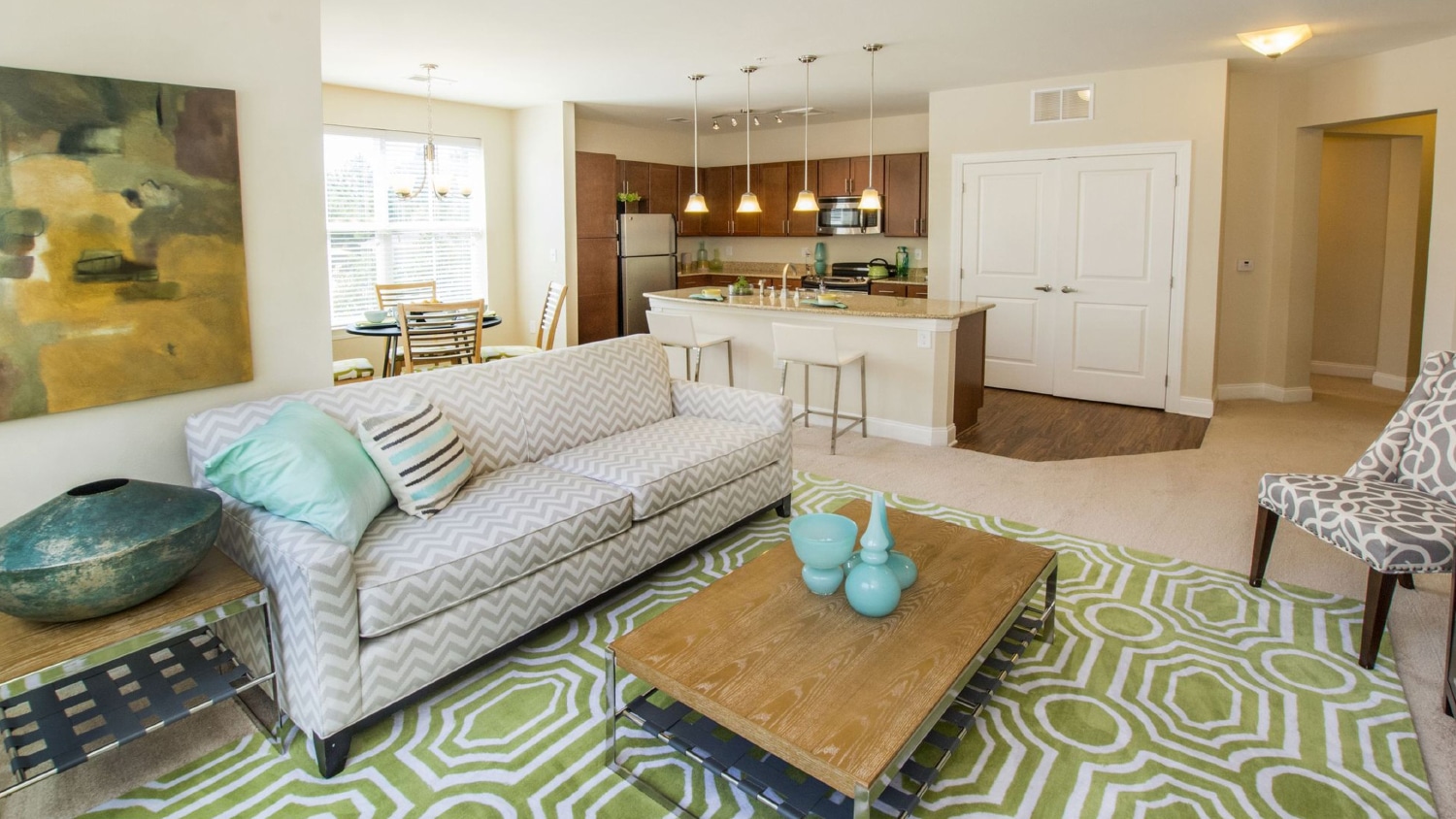 A well-appointed living room in The Greens at Centennial, an apartment community.