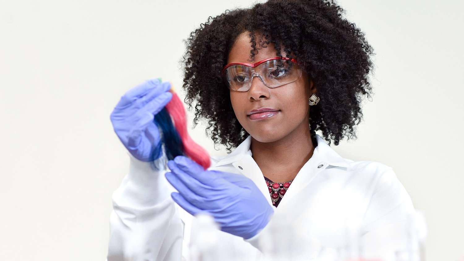 A student works in the field of textiles.